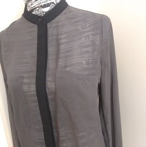 Sheer gray tunic top with black trim